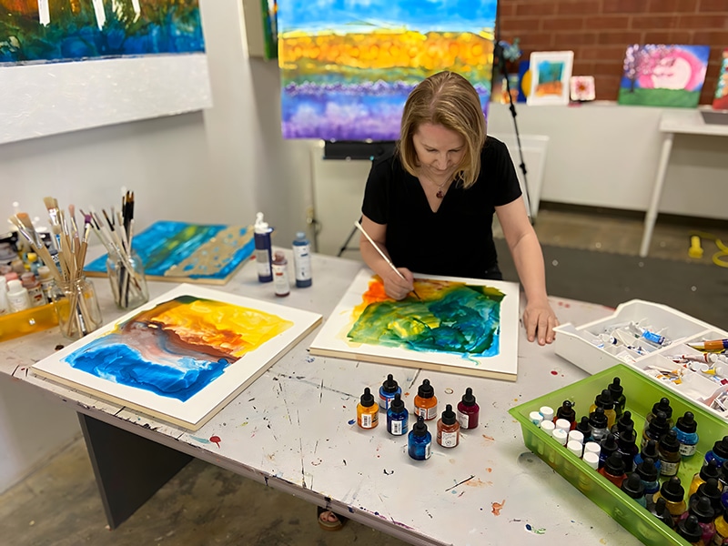Artist Anya McManis working in her studio